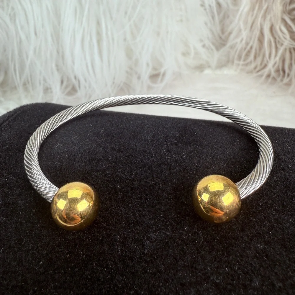 Pretty silvertone and goldtone, twisted cuff bracelet